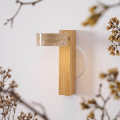 Lumen wall lamp yellow travertine stone lit natural veining detail close up