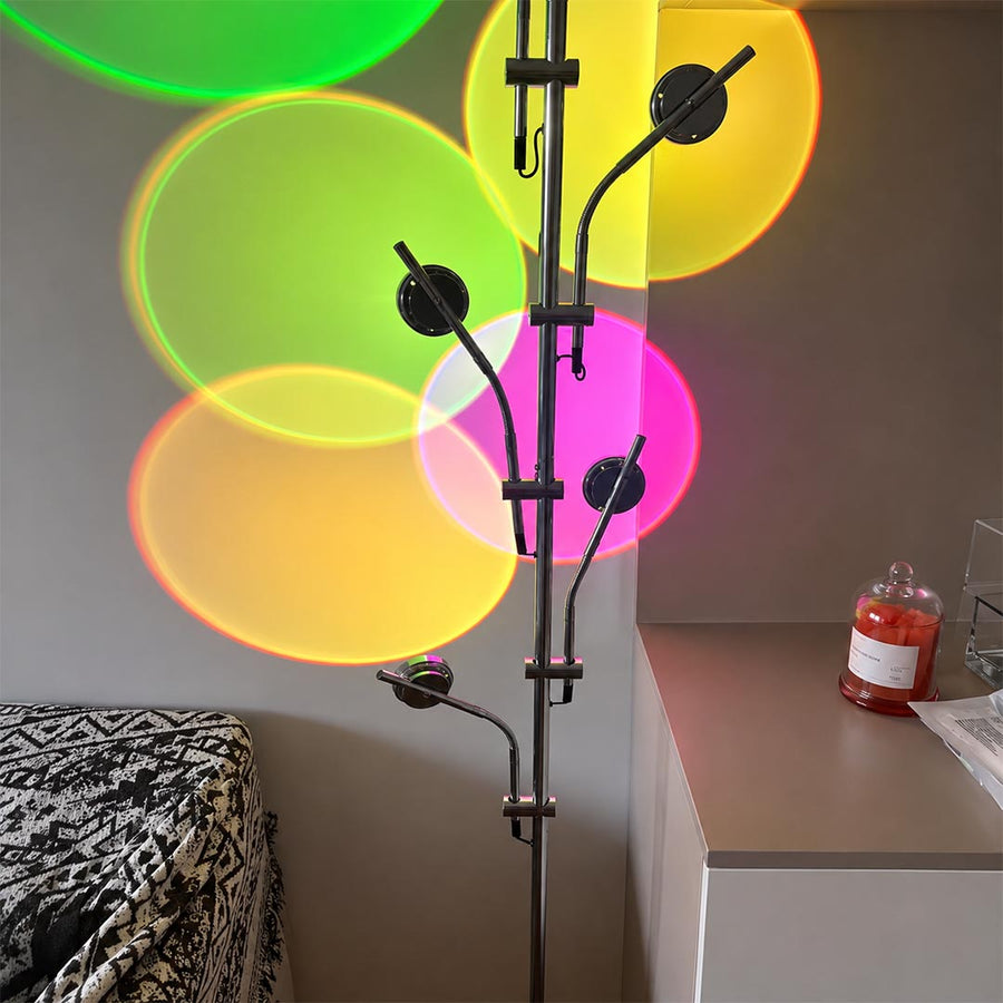 Lumi slim cordless floor lamp behind sectional sofa narrow gap living room ambient warm light modern interior