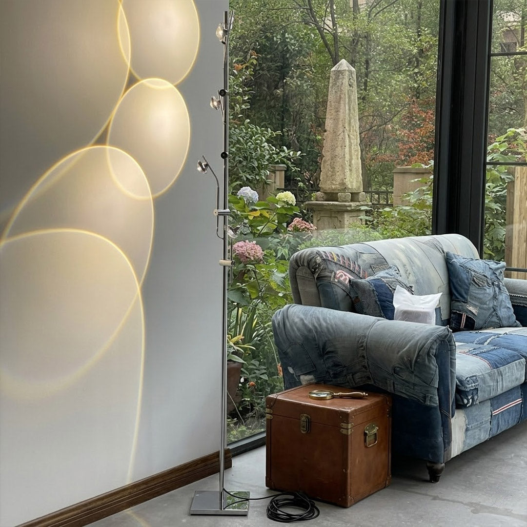 Lumi cordless slim floor lamp standing in modern living room corner warm white glow minimalist neutral interior