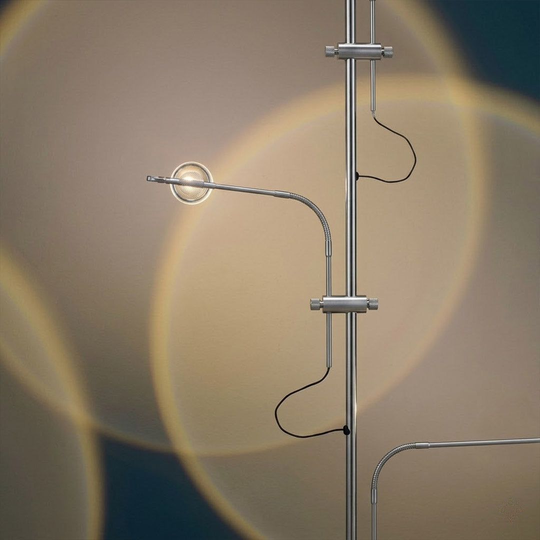Lumi chrome plated stainless steel base transparent glass tube close up minimalist modern craftsmanship detail