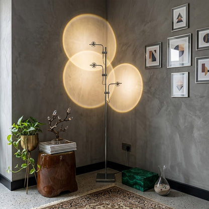 Lumi cordless slim floor lamp standing in modern living room corner warm white glow minimalist neutral interior