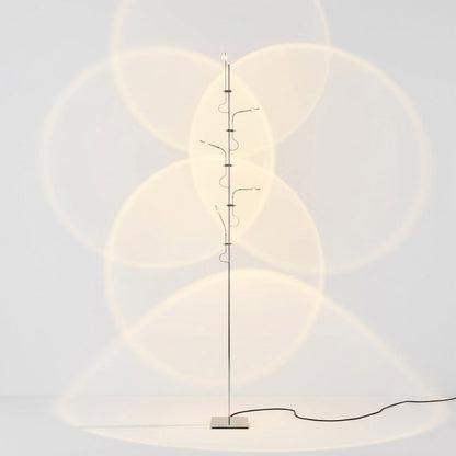 Lumi cordless slim floor lamp 62 inch chrome base transparent glass tube integrated LED minimalist white background