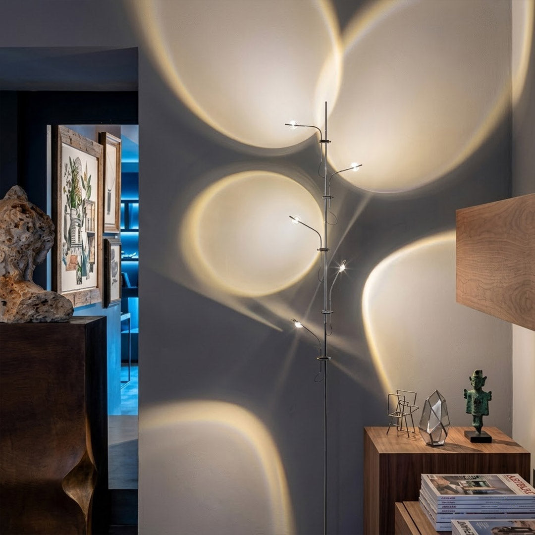 Lumi slim floor lamp standing at end of narrow hallway vertical glass tube ambient light modern minimalist interior