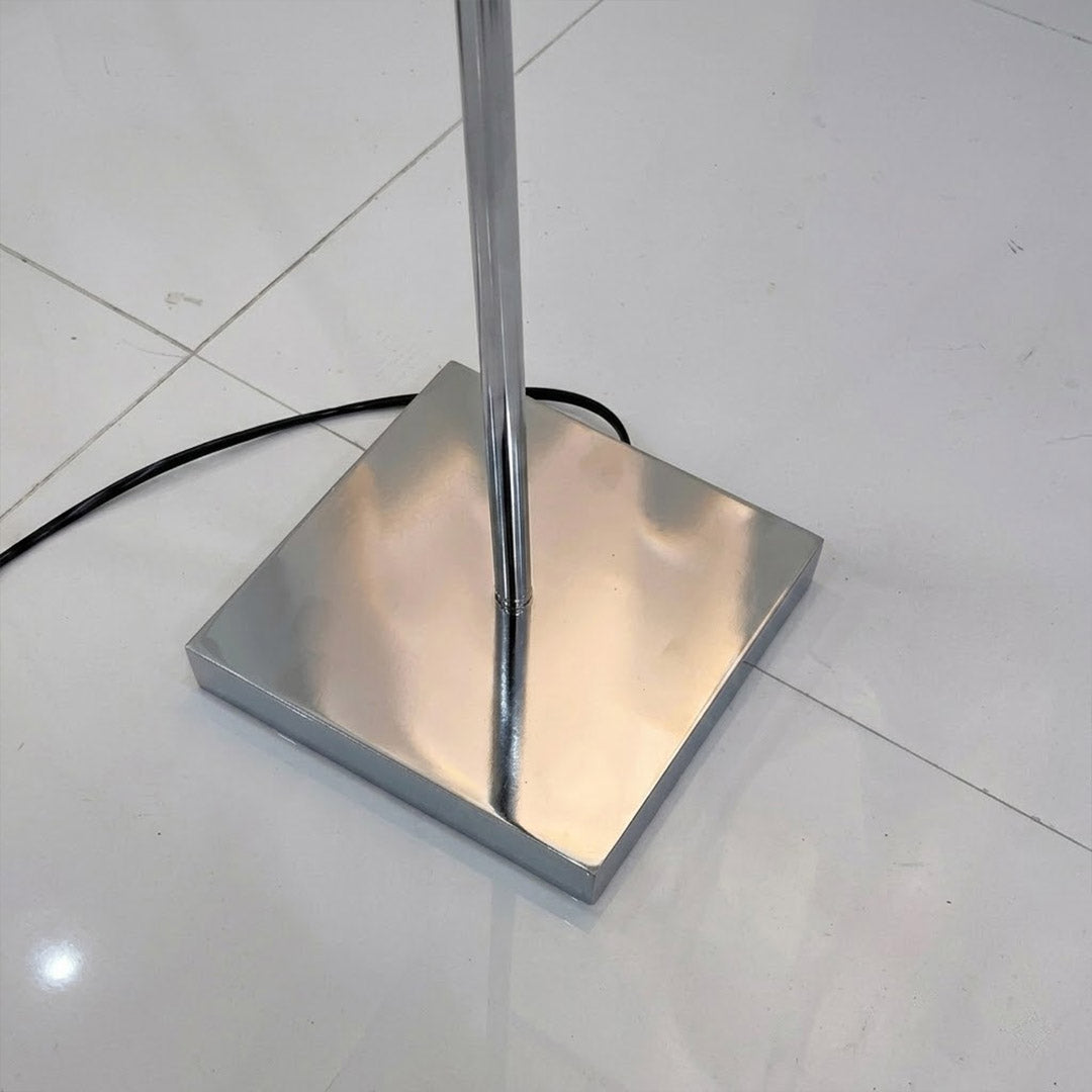 Lumi chrome plated stainless steel base transparent glass tube close up minimalist modern craftsmanship detail