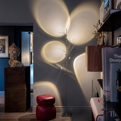 Lumi cordless slim floor lamp standing in modern living room corner warm white glow minimalist neutral interior