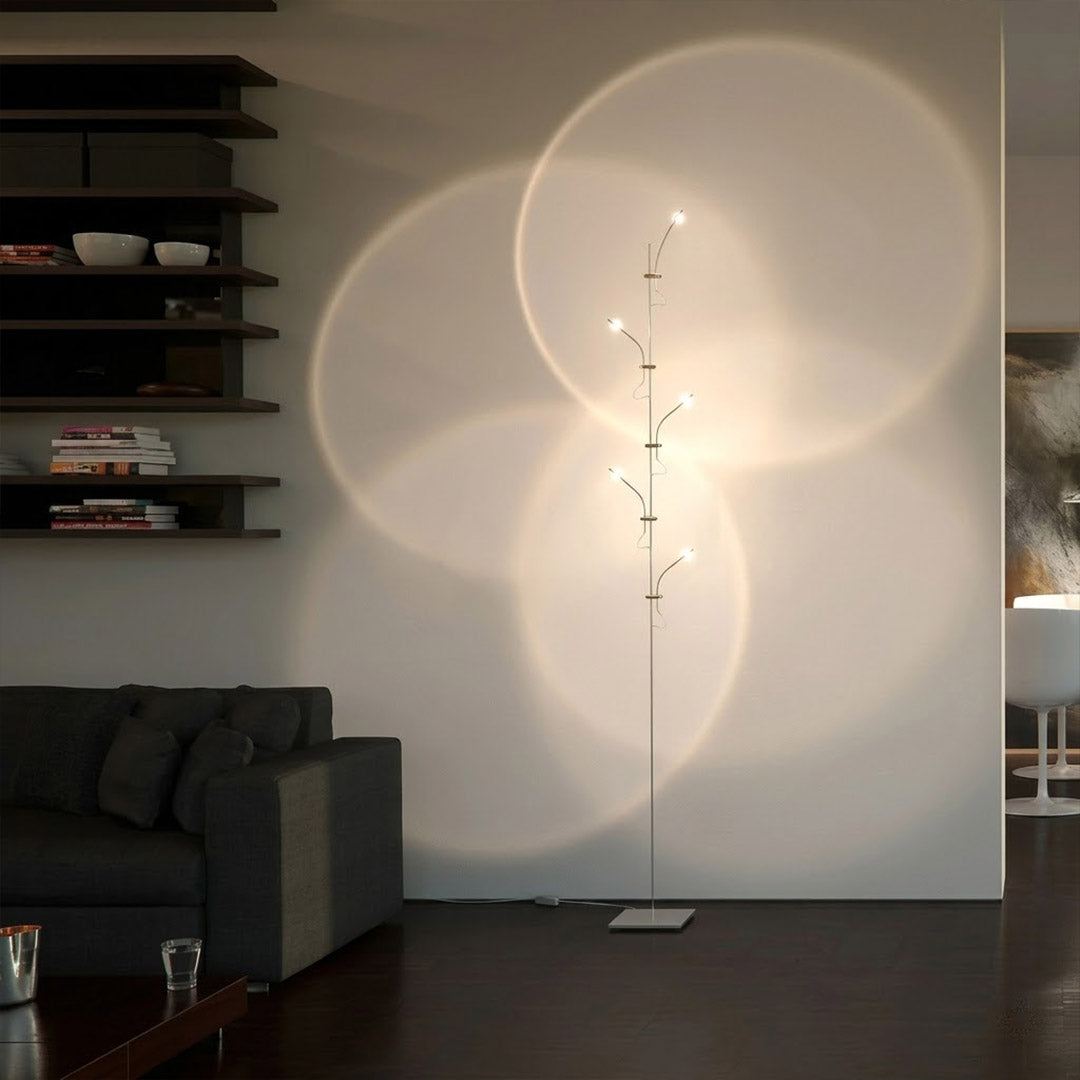 Lumi cordless slim floor lamp standing in modern living room corner warm white glow minimalist neutral interior