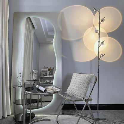 Lumi cordless slim floor lamp standing in modern living room corner warm white glow minimalist neutral interior