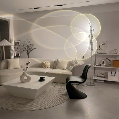 Lumi slim cordless floor lamp behind sectional sofa narrow gap living room ambient warm light modern interior