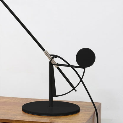 Lyra articulated table lamp side view arm fully extended matte black sculptural silhouette mid century architectural design