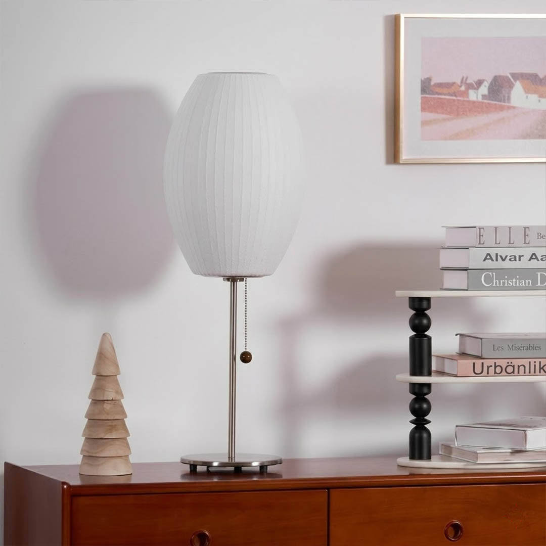 Maeve tall chrome console lamp Mid Century modern living room Eames era furniture warm Edison glow architectural luxury interior