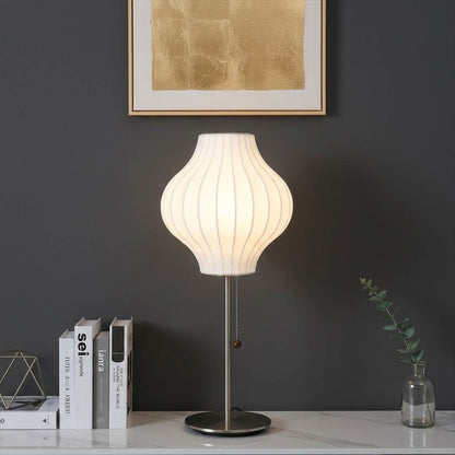 Maeve tall chrome console lamp Mid Century modern living room Eames era furniture warm Edison glow architectural luxury interior