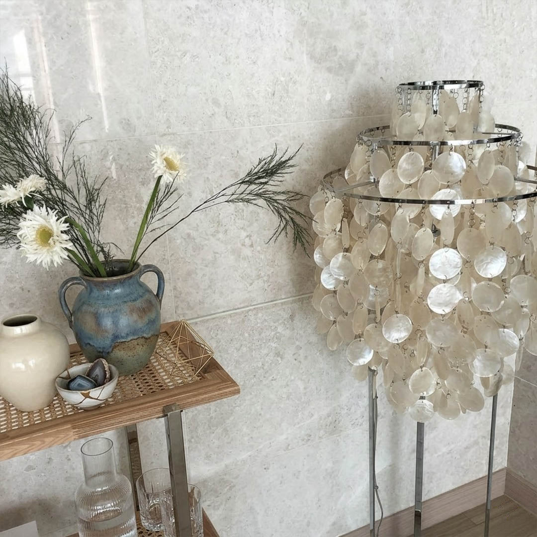Marina Gold Capiz shell floor lamp beach house living room corner Coastal Hampton white wood interior warm glow natural lifestyle