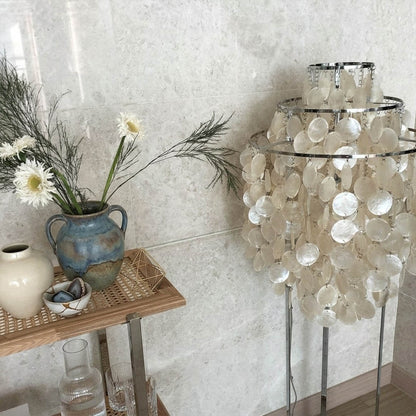 Marina Gold Capiz shell floor lamp beach house living room corner Coastal Hampton white wood interior warm glow natural lifestyle