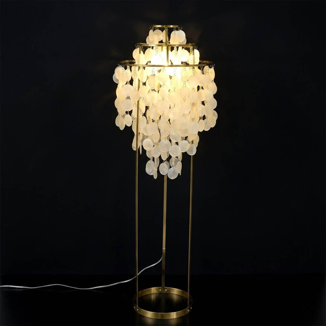 Marina illuminated Capiz shells warm 2700K glow evening atmosphere pearl iridescent Coastal Boho detail close up