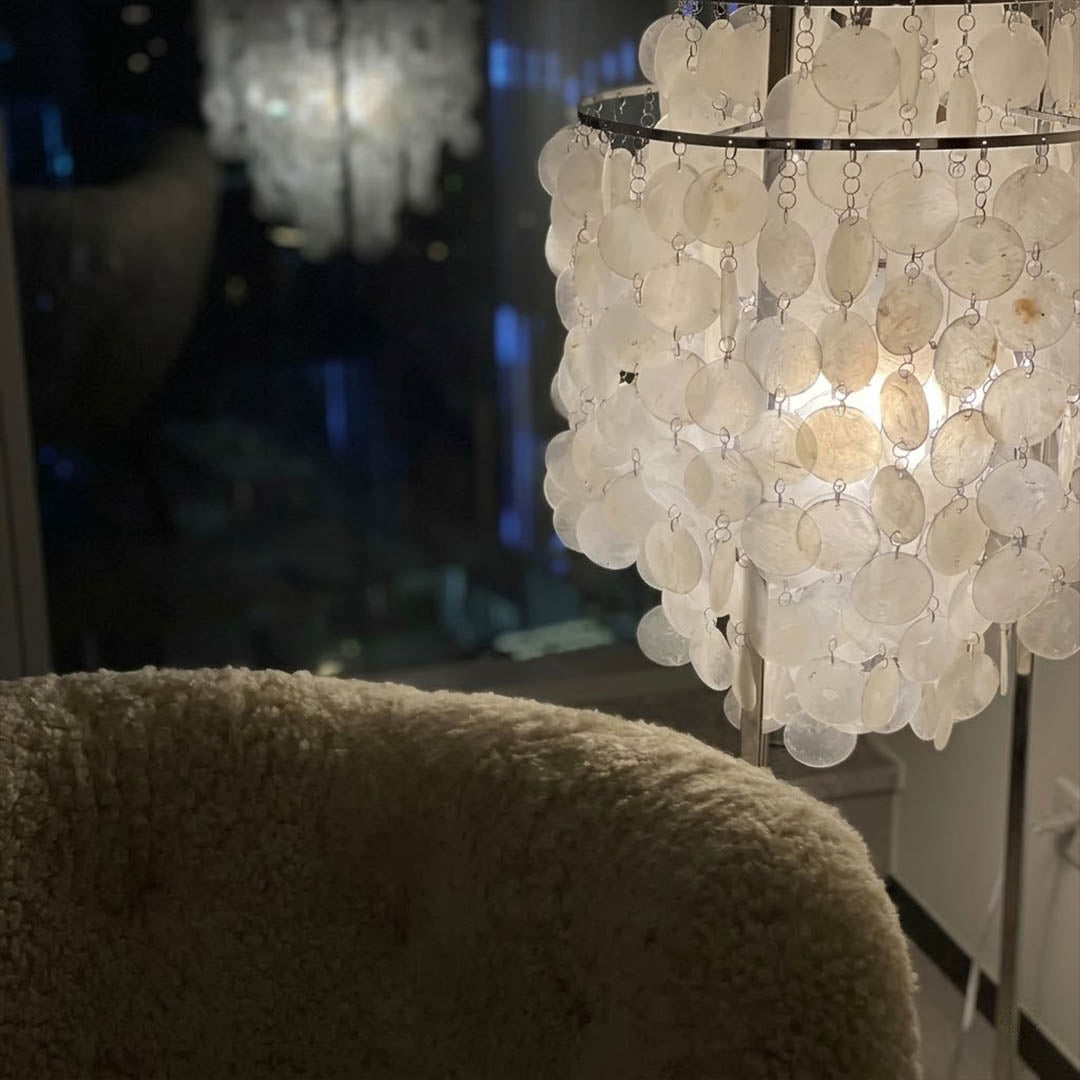 Marina Gold Capiz shell floor lamp sofa side accent placement Coastal modern living room warm pearl glow lifestyle