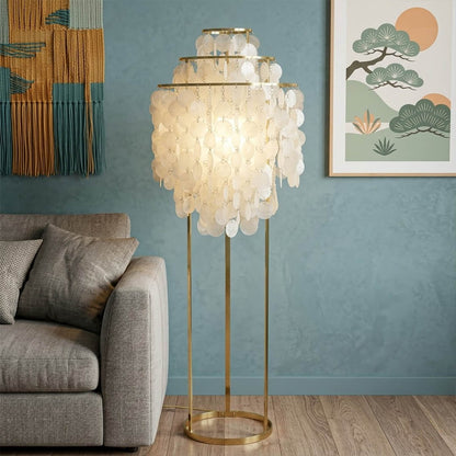 Marina Gold Capiz shell floor lamp sofa side accent placement Coastal modern living room warm pearl glow lifestyle