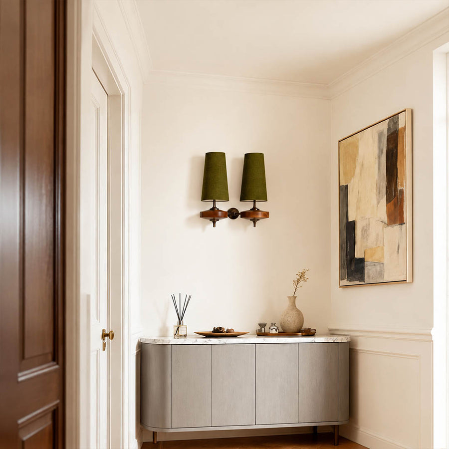 Marnie twin shade wall sconce entryway foyer illuminated warm glow mid-century bronze walnut welcoming American home lifestyle interior