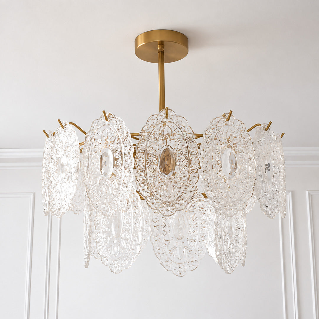 Detail of the warm metal frame and rod of the Merletto tiered chandelier