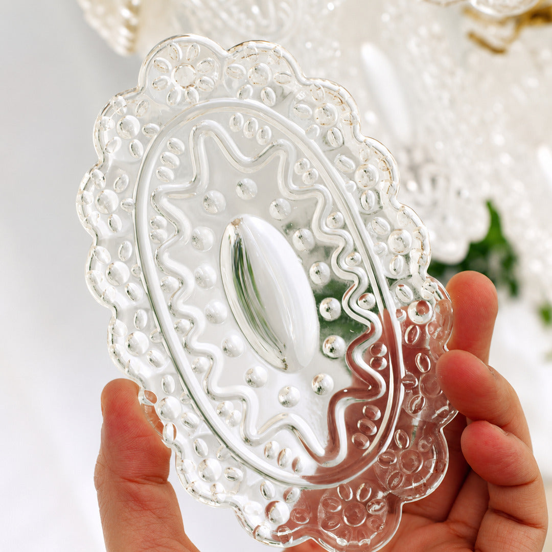 Close-up of the rippled lace-pattern glass panels on the Merletto chandelier