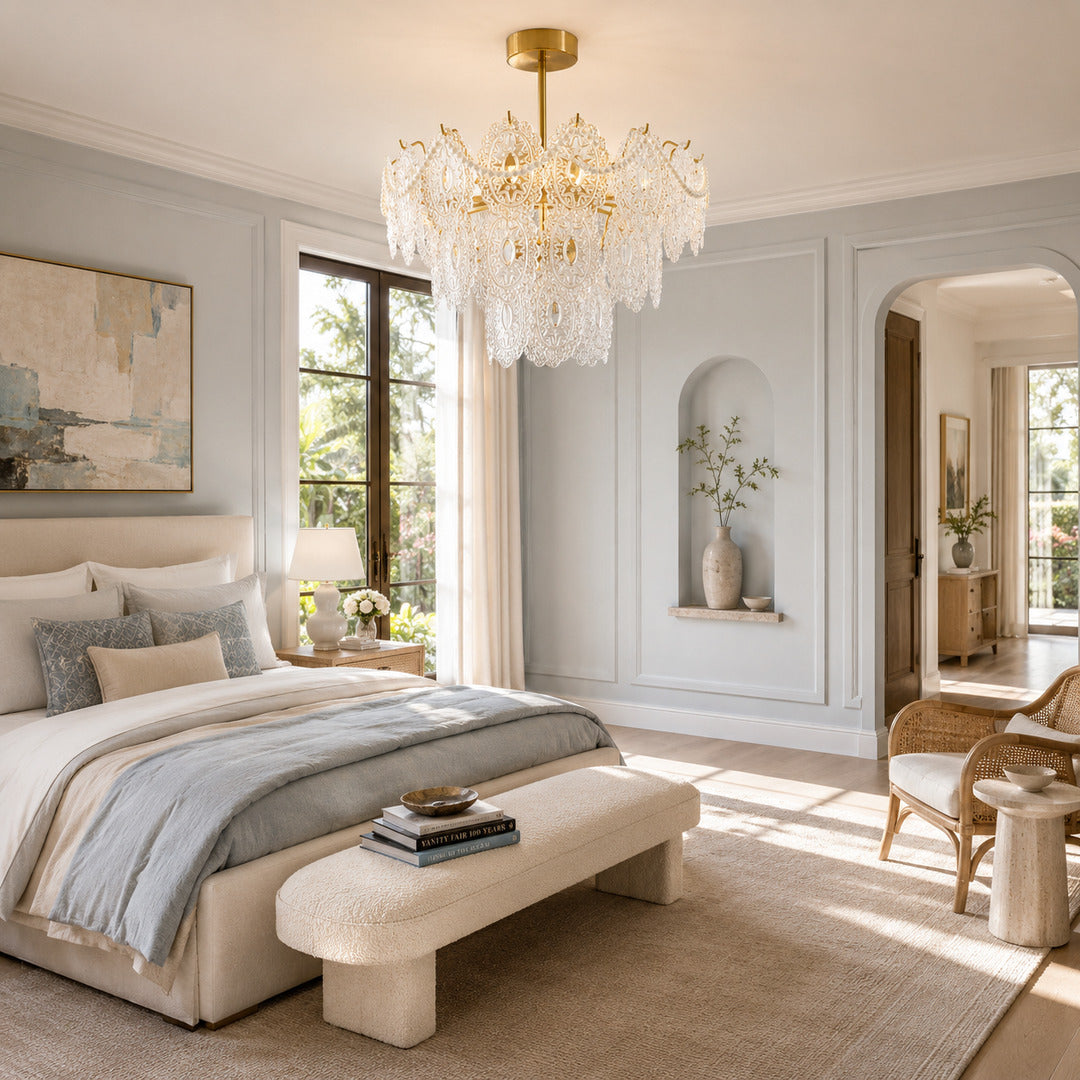 Merletto glass chandelier with pearl accents casting a dreamy glow in a bedroom