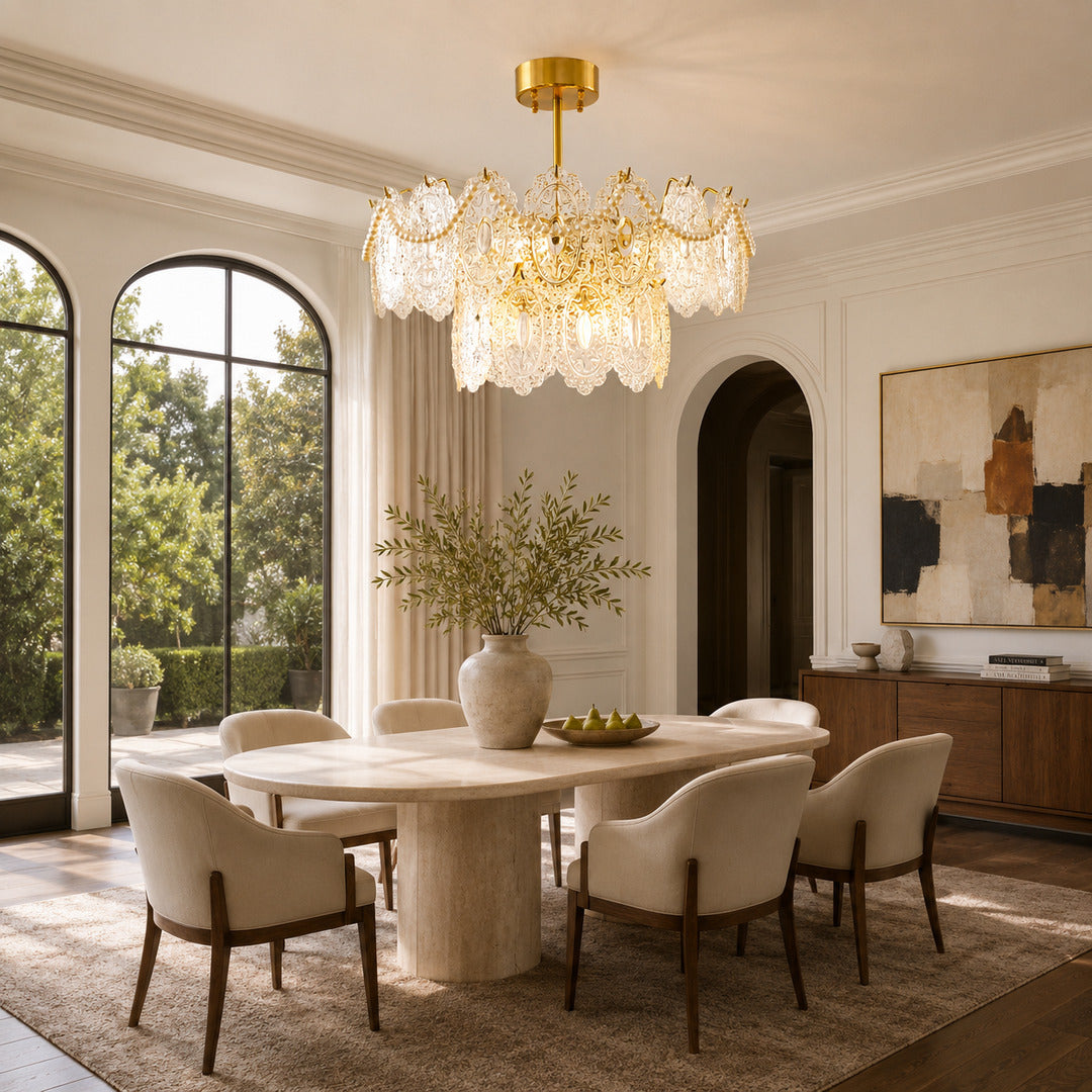 Merletto tiered glass chandelier hanging over a round dining table