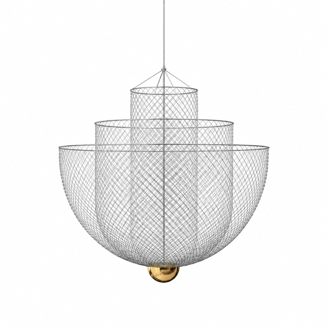 Meshmatics chandelier with a three-layer woven metal mesh globe glowing warm over a dining table
