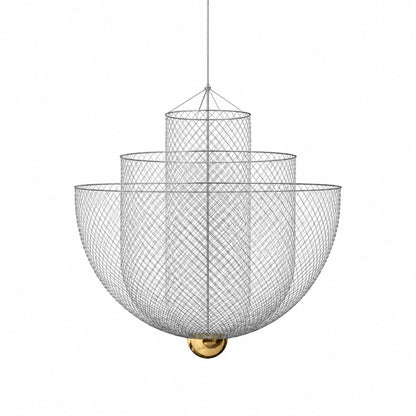 Meshmatics chandelier with a three-layer woven metal mesh globe glowing warm over a dining table