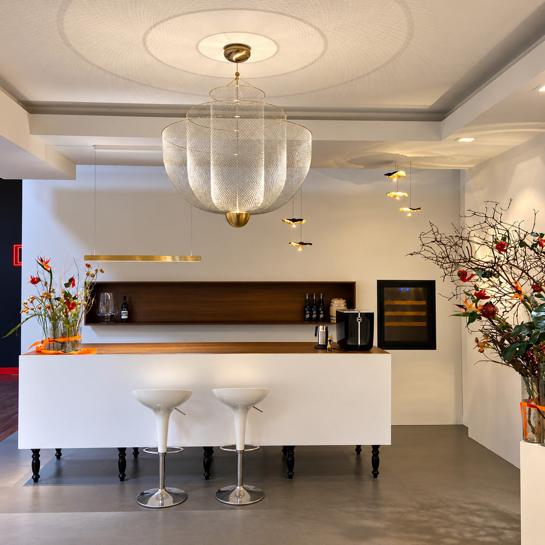 Meshmatics chandelier suspended over a modern kitchen island