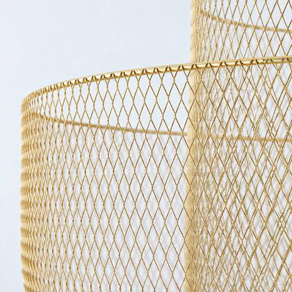 Warm light filtering through the layered metal mesh of the Meshmatics chandelier