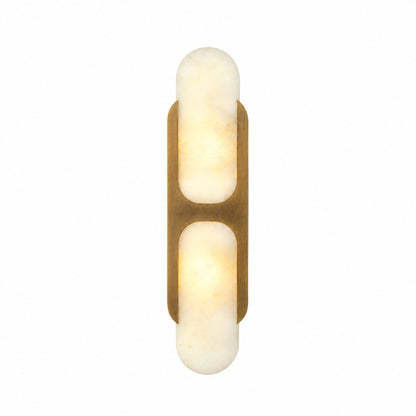 Mezzaluna alabaster wall sconce with a half-cylinder natural stone shade glowing warm on a wall