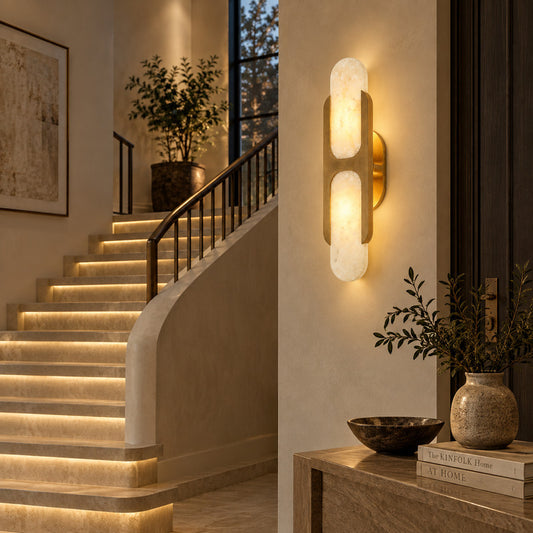 Mezzaluna alabaster wall sconce lighting a staircase wall with a soft natural-stone glow
