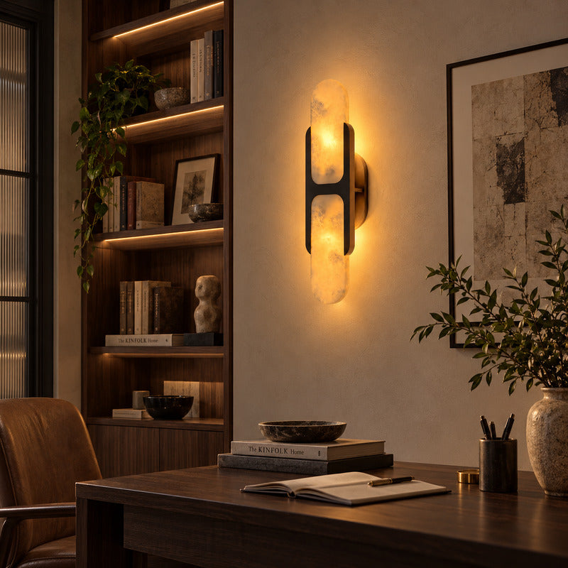 Black Mezzaluna alabaster wall sconce suiting a bright Scandinavian room with neutral tones