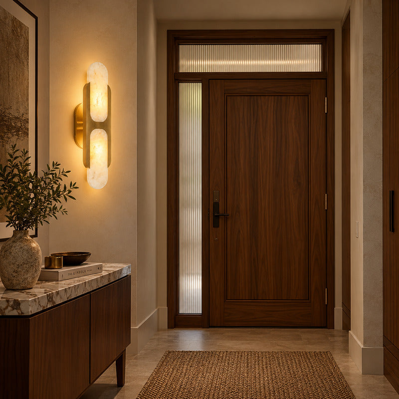 Mezzaluna alabaster wall sconce welcoming guests with a warm glow above an entry console