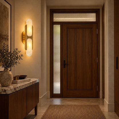Mezzaluna alabaster wall sconce welcoming guests with a warm glow above an entry console