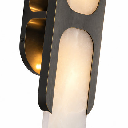 Detail of the slim backplate and metal hardware of the Mezzaluna alabaster wall sconce