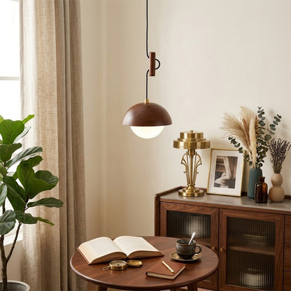 Mochi mini pendant hanging above reading armchair warm 3000K light cozy corner Japandi interior