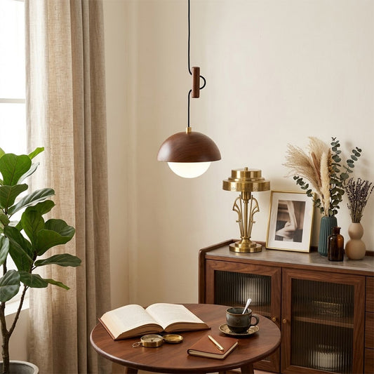 Mochi mini pendant hanging above reading armchair warm 3000K light cozy corner Japandi interior