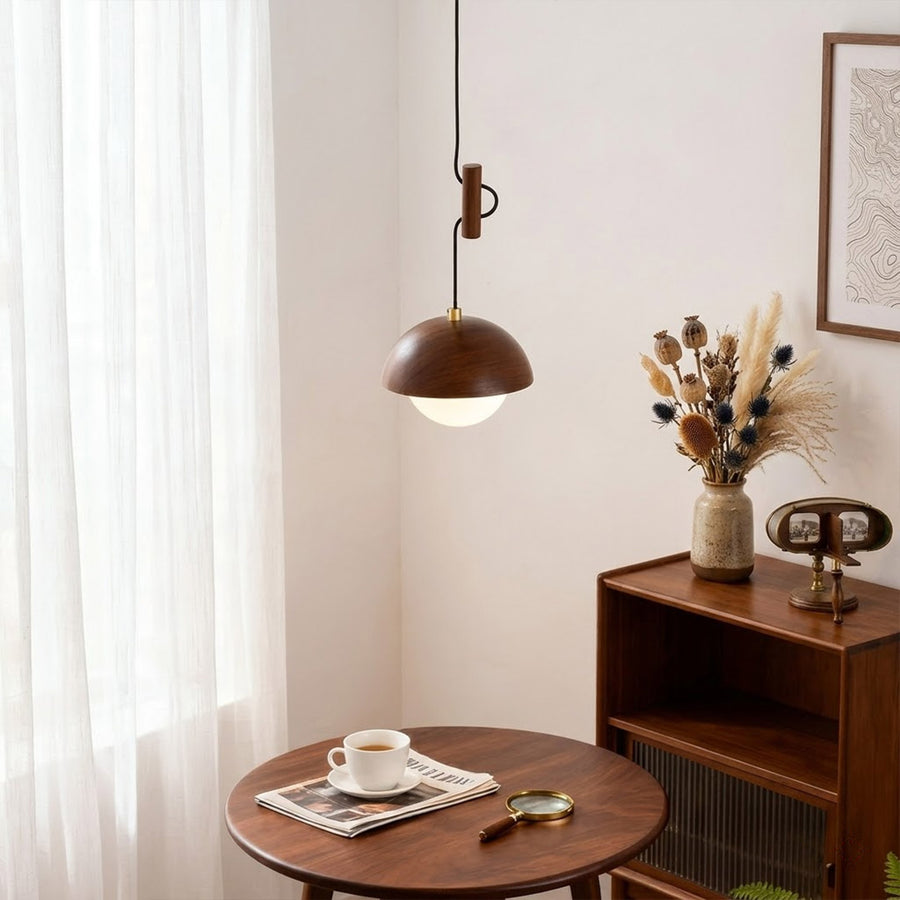 Mochi mini pendant hanging above reading armchair warm 3000K light cozy corner Japandi interior