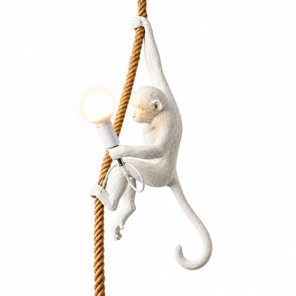 Monkey pendant light with a lifelike resin monkey holding a glowing bulb hanging from a rope