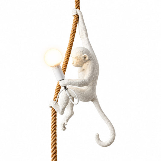 Monkey pendant light with a lifelike resin monkey holding a glowing bulb hanging from a rope