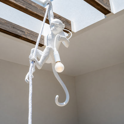 Monkey pendant light welcoming guests with a playful silhouette in an entryway