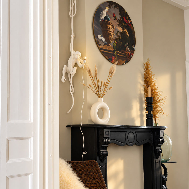 Monkey pendant light welcoming guests with a playful silhouette in an entryway