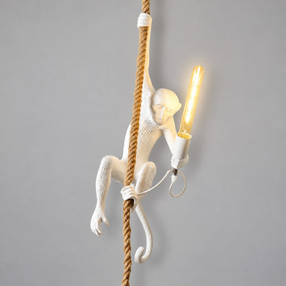 White Monkey pendant light hanging in a modern stairwell as a playful accent