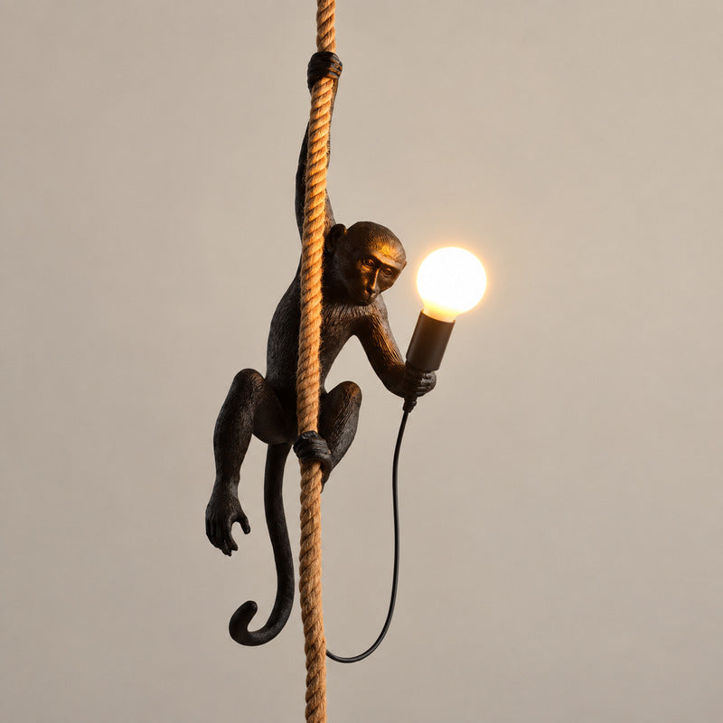 Black Monkey pendant light hanging in a hallway as a bold conversation piece