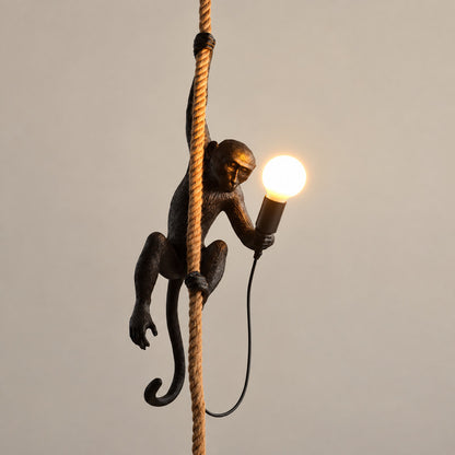 Black Monkey pendant light hanging in a hallway as a bold conversation piece