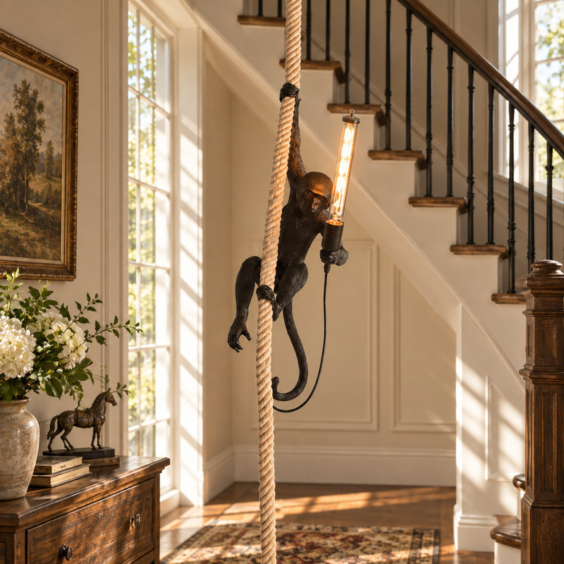 Monkey pendant light hanging in an open stairwell as a whimsical eye-catching accent