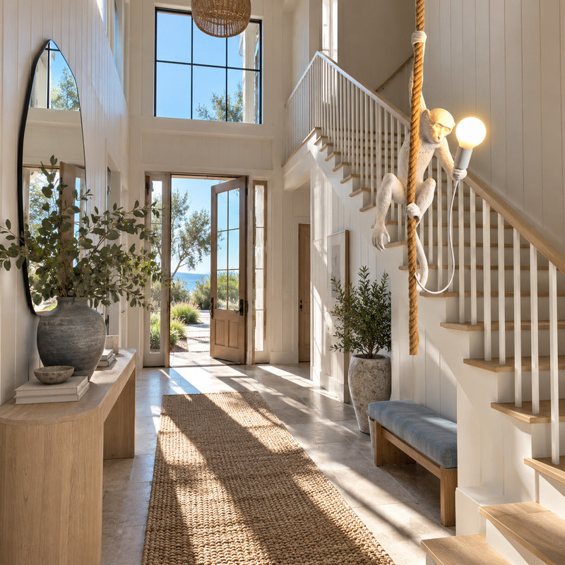 Monkey pendant light welcoming guests with a playful silhouette in an entryway