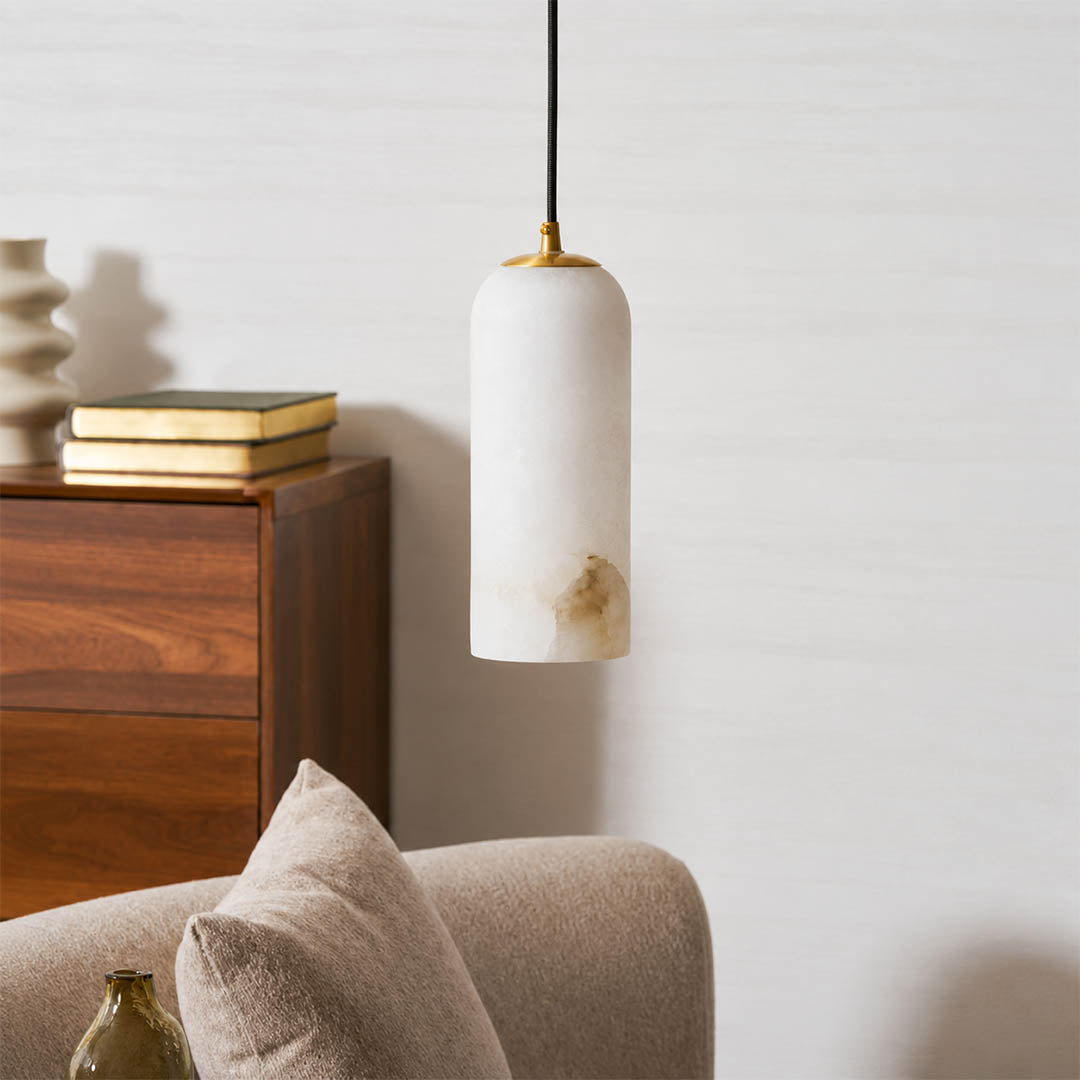 Monvela alabaster pendant light illuminated glowing veining warm soft radiance translucent stone detail close up quiet luxury