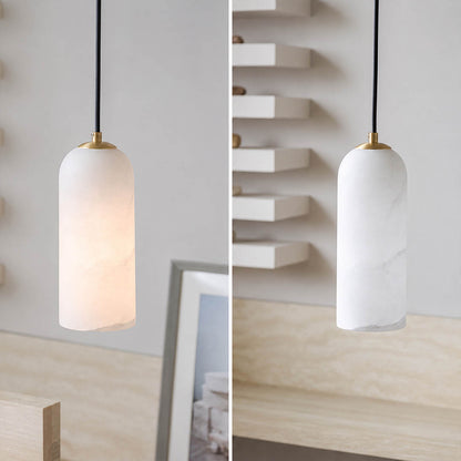Monvela alabaster pendant light illuminated warm glow translucent natural stone braided cord soft radiance white background