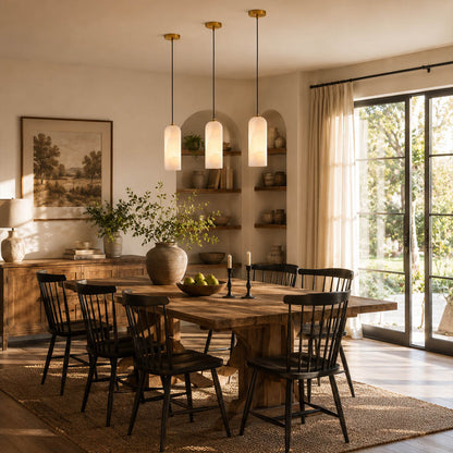 Monvela alabaster pendant light dining room above table natural stone brass warm glow mid century American home lifestyle interior styled